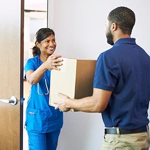 Delivery man giving a box of McKesson products to a nurse