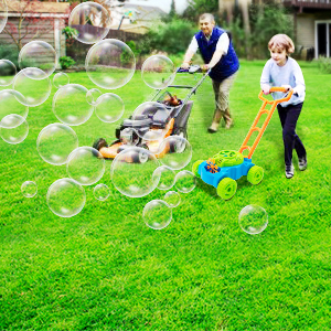 Mowing with dad on the lawn