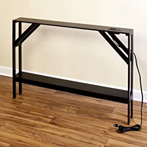 This slim accent table with outlets can be used around the home with ease.