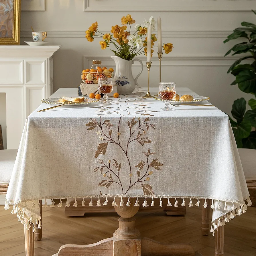 Oubonun Cotton Linen Rectangular Table Cloth, Wrinkle Resistant, Waterproof Tablecloth, Washable Farmhouse Table Cover with Tassels for Kitchen Dining Party, 55''x86'', 6-8 Seats, Beige